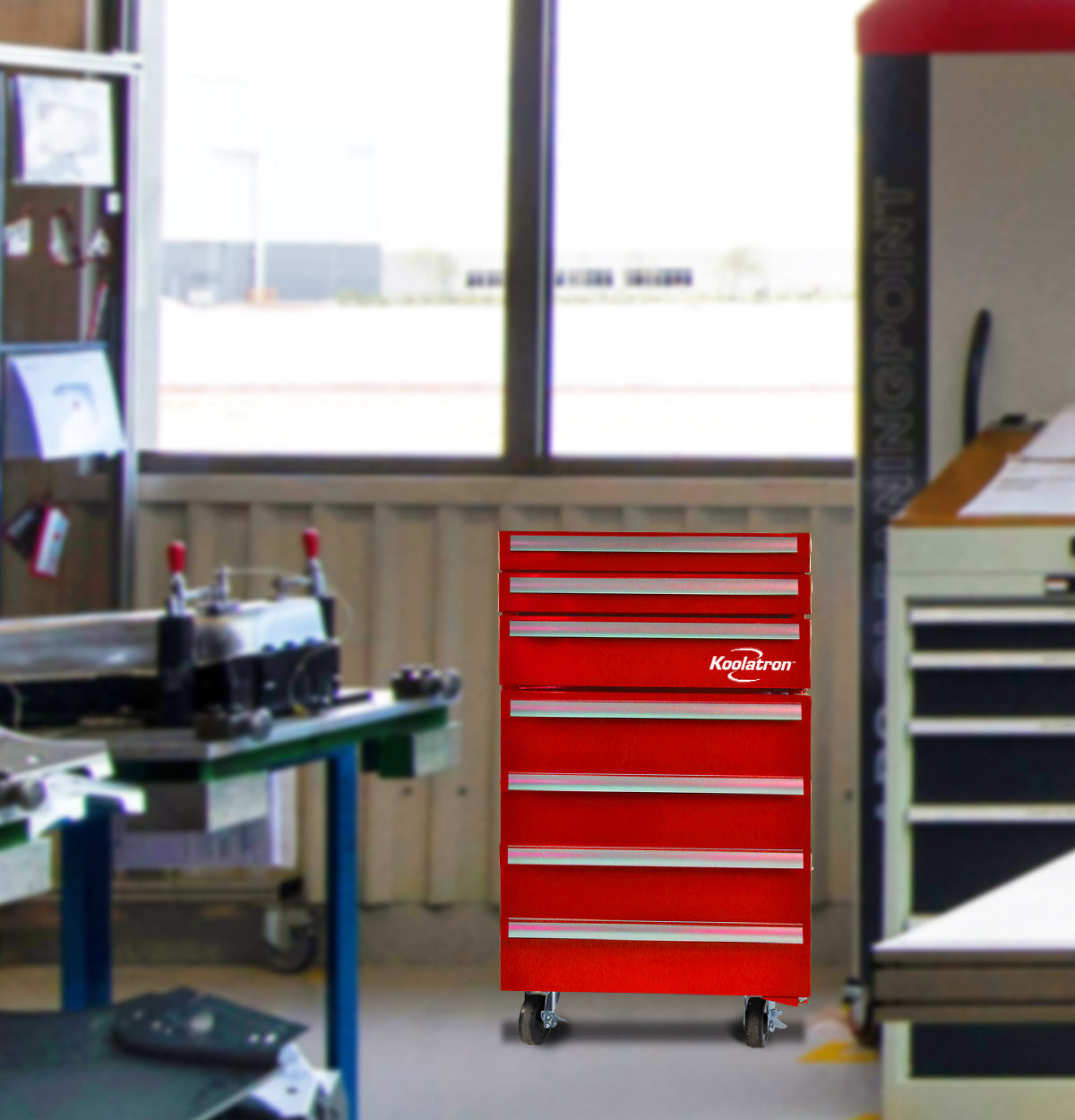 Lifestyle image of Kool-atronrolling compact fridge with tool storage in a workshop