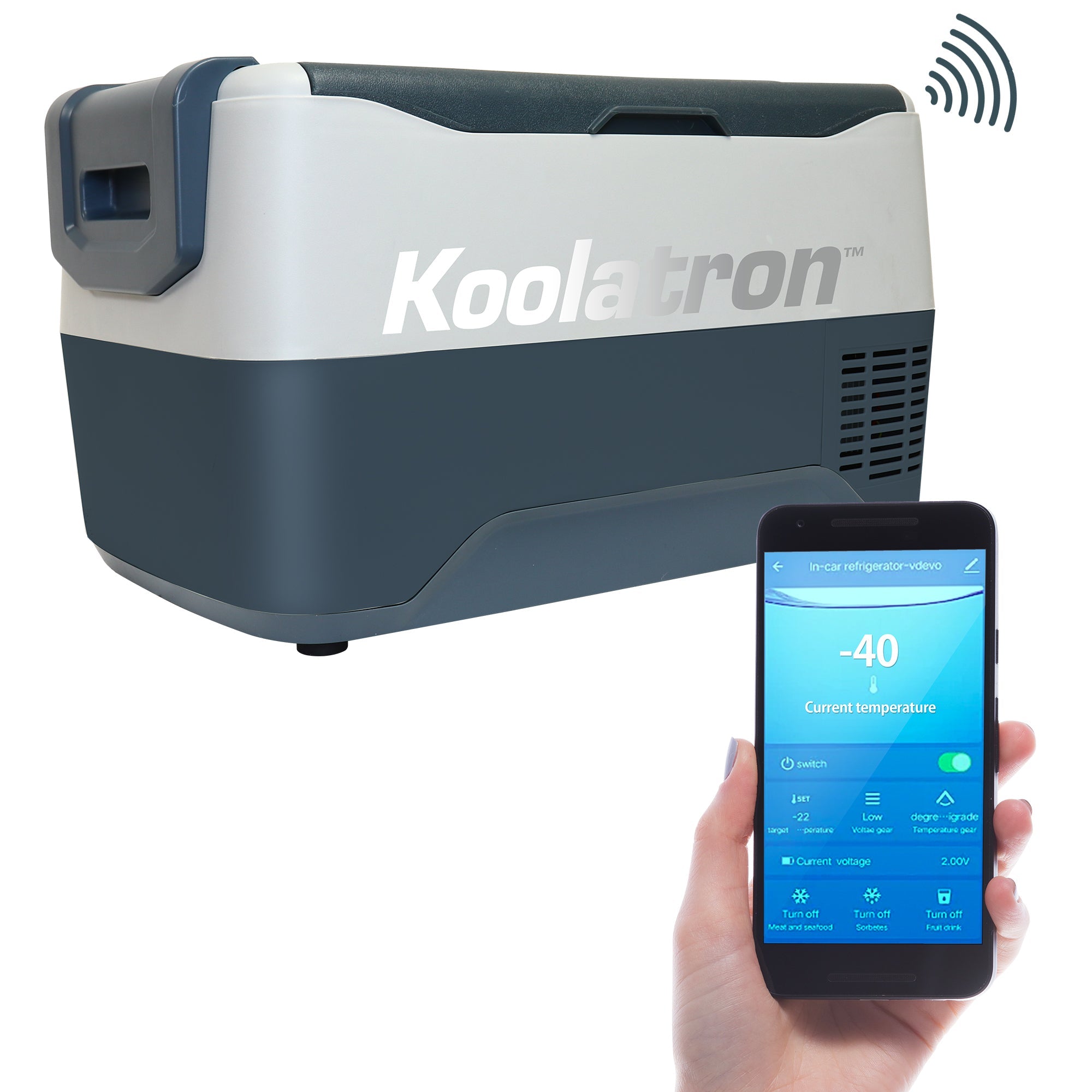 Product shot of 12V travel fridge/freezer on a white background with a person's hand holding a smartphone with the Kool-atronSmart app on the screen in the foreground