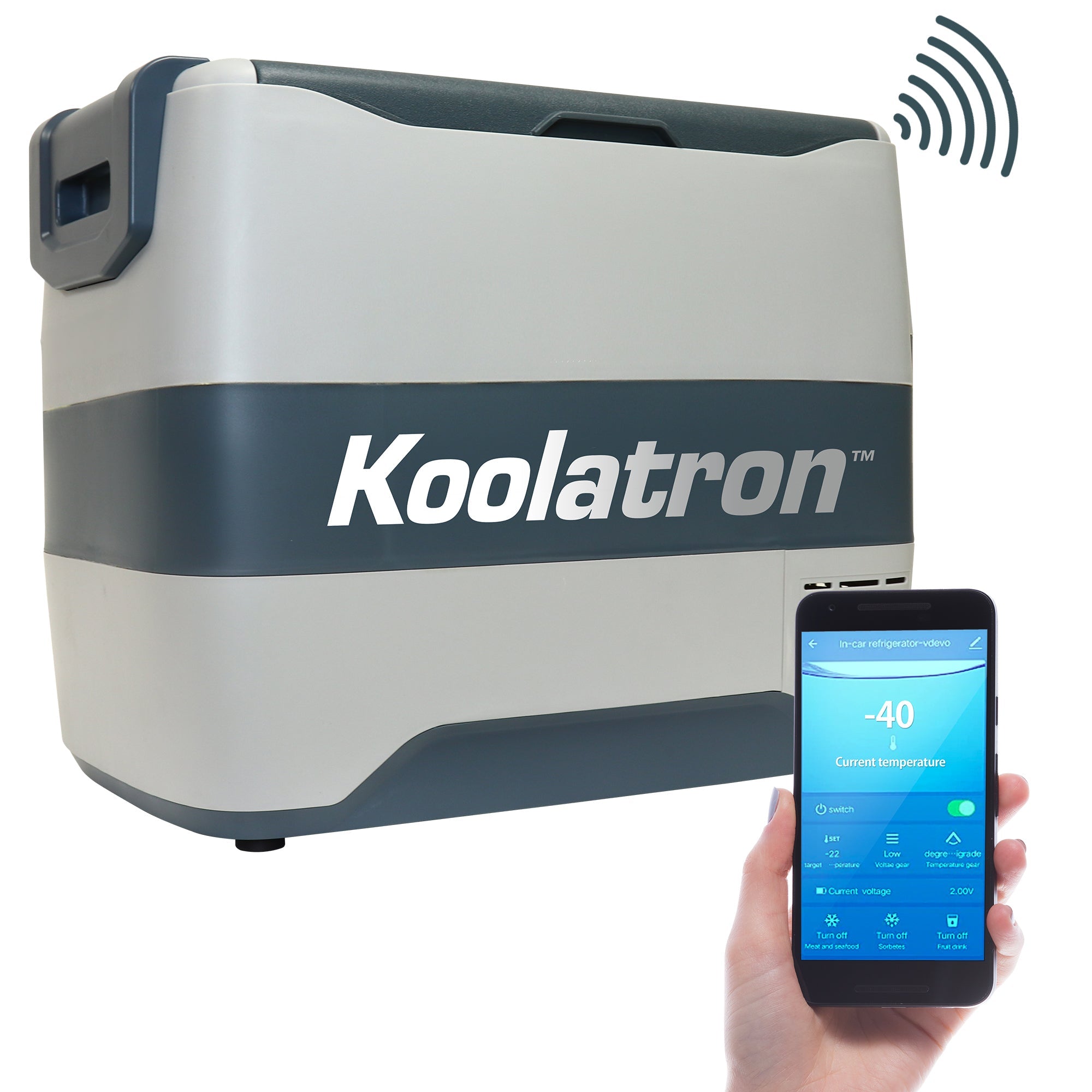 Product shot of 12V travel fridge/freezer on a white background with a person's hand holding a smartphone with the Kool-atronSmart app on the screen in the foreground